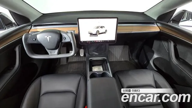 Tesla Model Y — Фото автомобиля 10