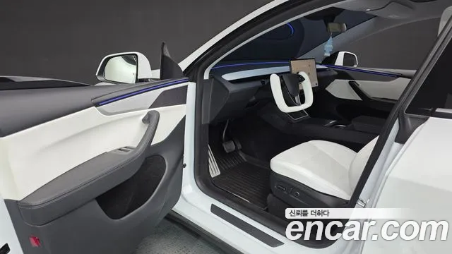 Tesla Model Y — Фото автомобиля 10