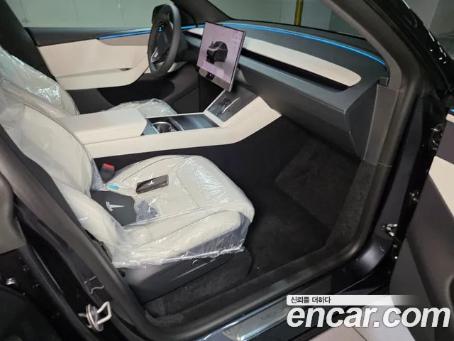 Tesla Model Y — Фото автомобиля 14