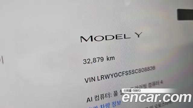 Tesla Model Y — Фото автомобиля 11