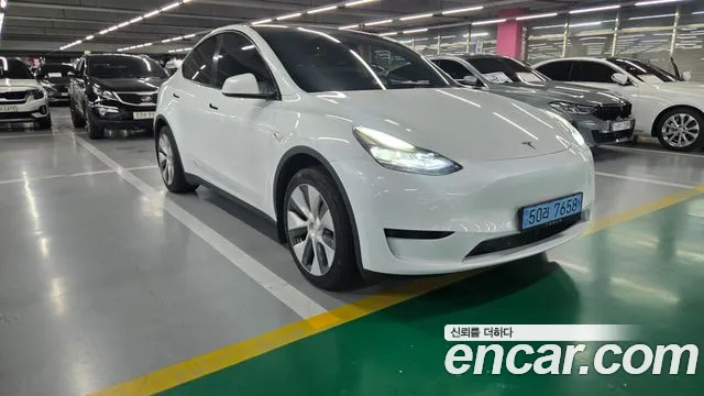 Tesla Model Y — Фото автомобиля 5