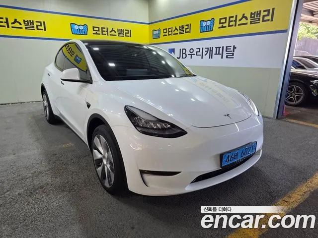 Tesla Model Y — Фото автомобиля 9