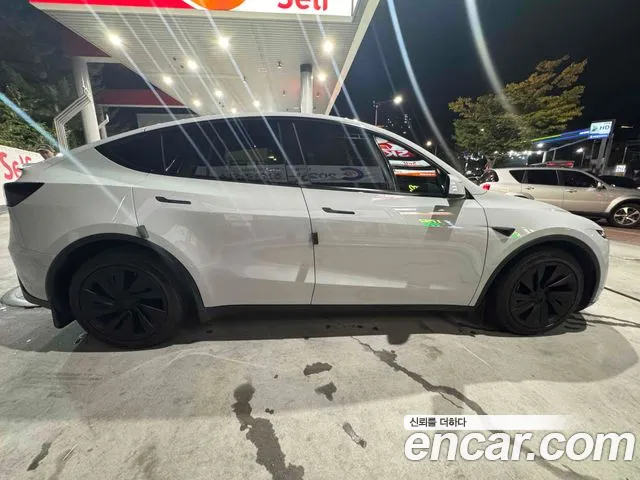 Tesla Model Y — Фото автомобиля 7