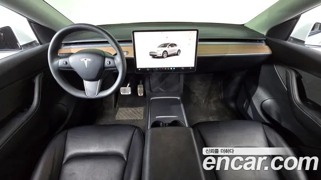 Tesla Model Y — Фото автомобиля 10