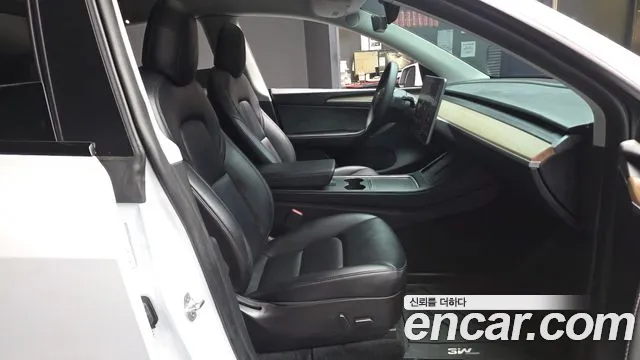 Tesla Model Y — Фото автомобиля 11