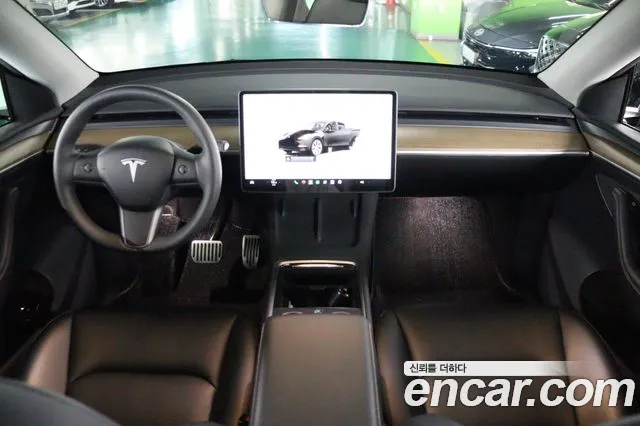 Tesla Model Y — Фото автомобиля 7