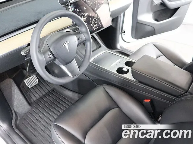 Tesla Model Y — Фото автомобиля 18