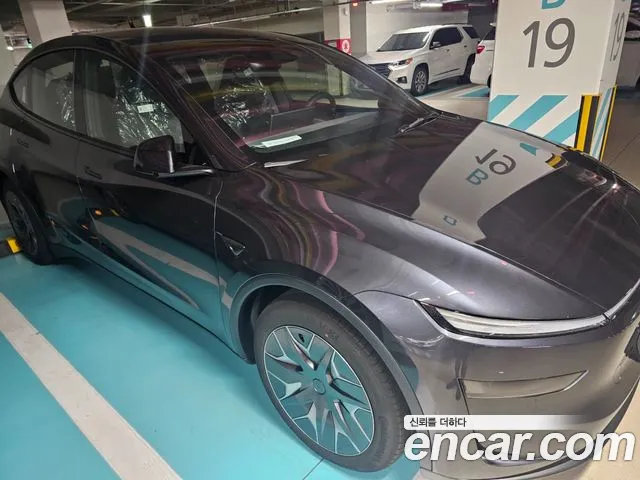 Tesla Model Y — Фото автомобиля 5