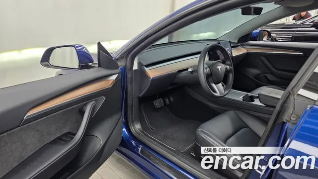 Tesla Model 3 — Фото автомобиля 15
