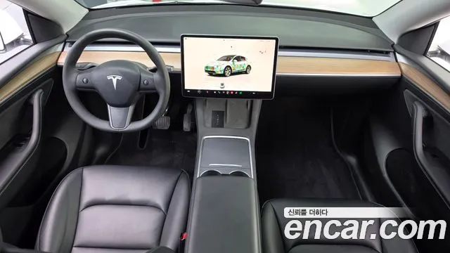 Tesla Model Y — Фото автомобиля 10
