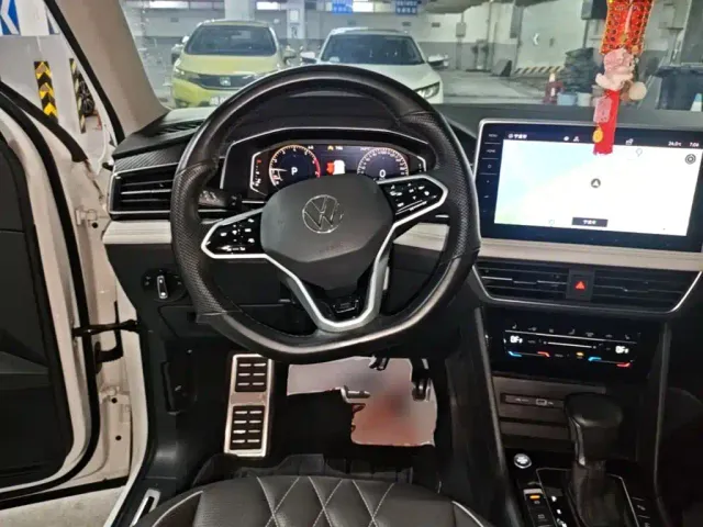 Volkswagen Tiguan L — Фото автомобиля 10