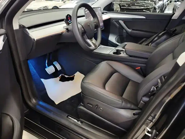 Tesla Model Y — Фото автомобиля 15