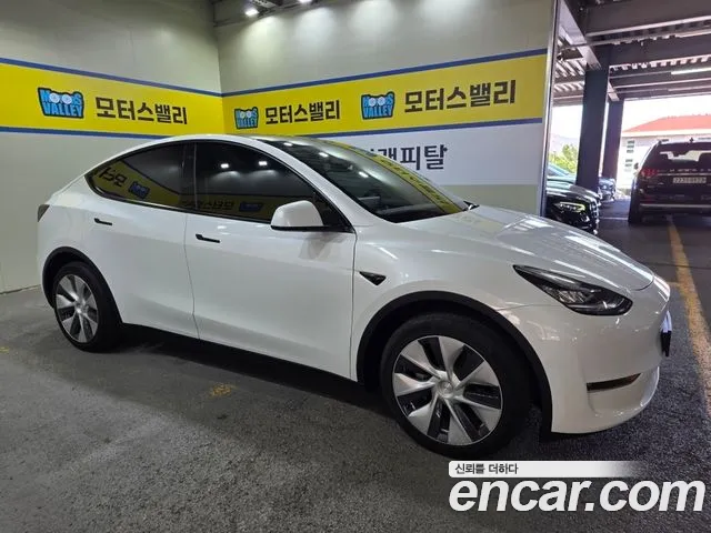 Tesla Model Y — Фото автомобиля 5