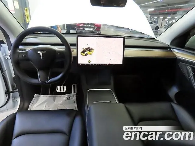 Tesla Model Y — Фото автомобиля 10