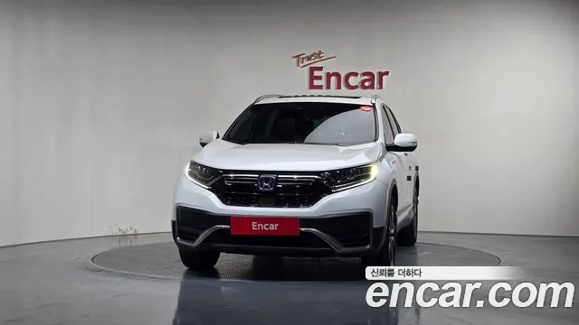 Фотография автомобиля — Honda CR-V CR-V 5-е поколение 2.0 гибрид Touring 4WD