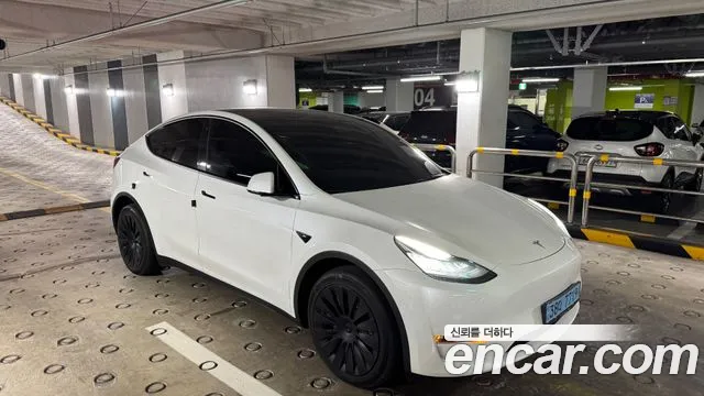 Tesla Model Y — Фото автомобиля 6