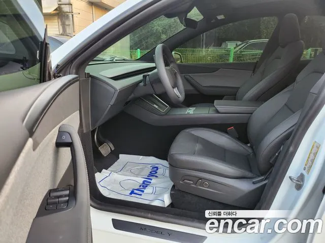 Tesla Model Y — Фото автомобиля 7