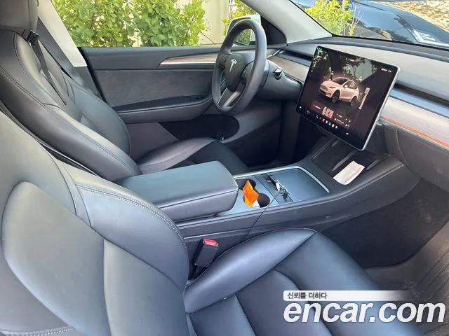 Tesla Model Y — Фото автомобиля 7