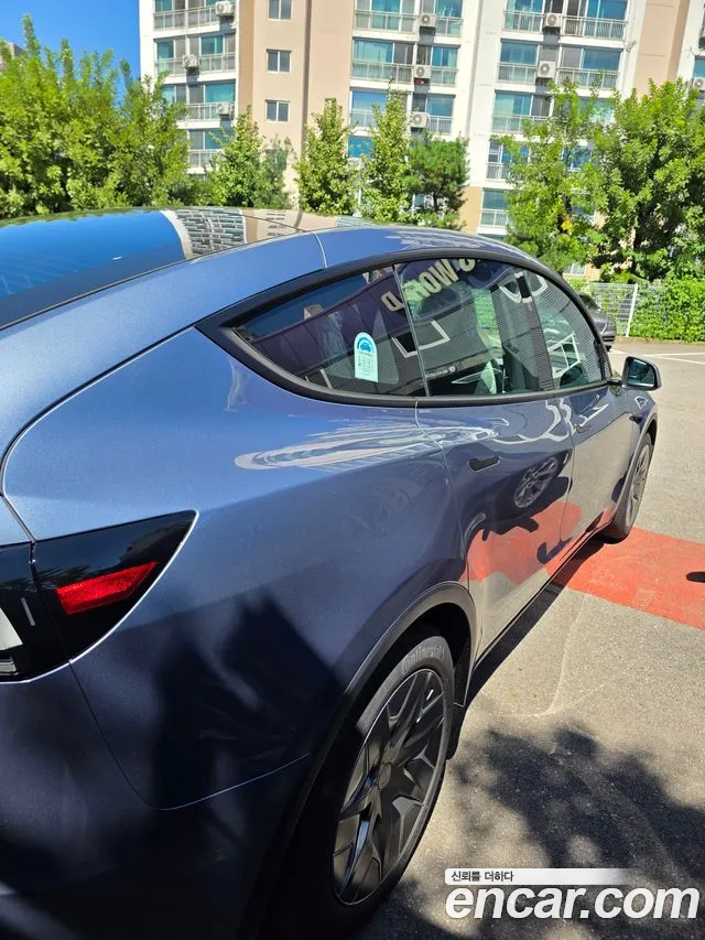Tesla Model Y — Фото автомобиля 10