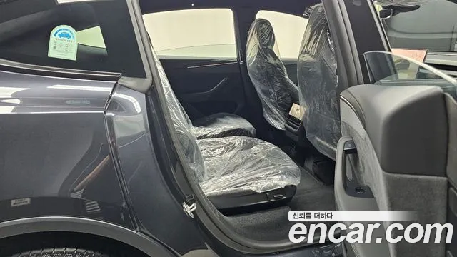 Tesla Model Y — Фото автомобиля 10