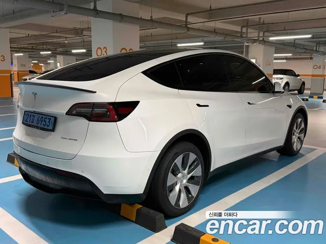 Tesla Model Y — Фото автомобиля 6