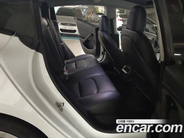 Tesla Model 3 — Фото автомобиля 11