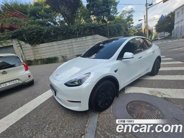 Tesla Model Y — Фото автомобиля 14