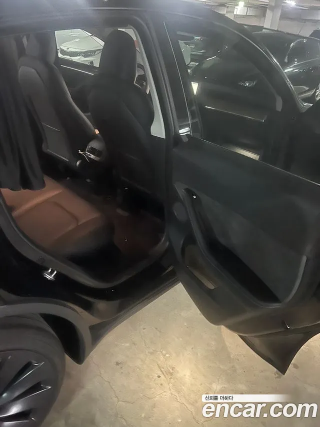Tesla Model Y — Фото автомобиля 16