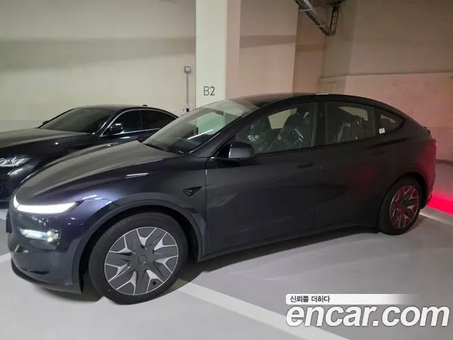 Tesla Model Y — Фото автомобиля 8