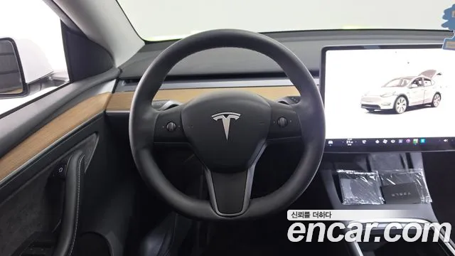 Tesla Model Y — Фото автомобиля 19