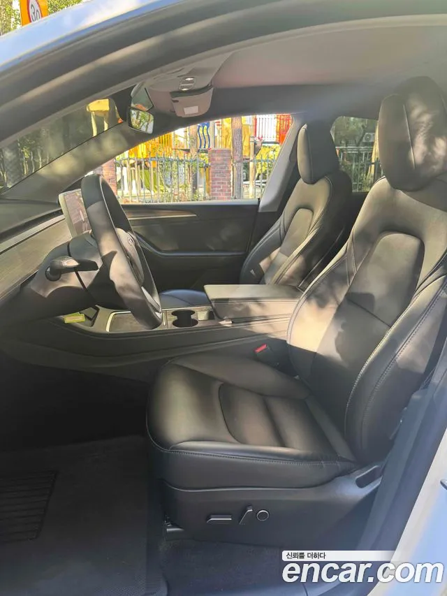 Tesla Model Y — Фото автомобиля 10