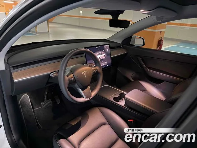 Tesla Model Y — Фото автомобиля 10