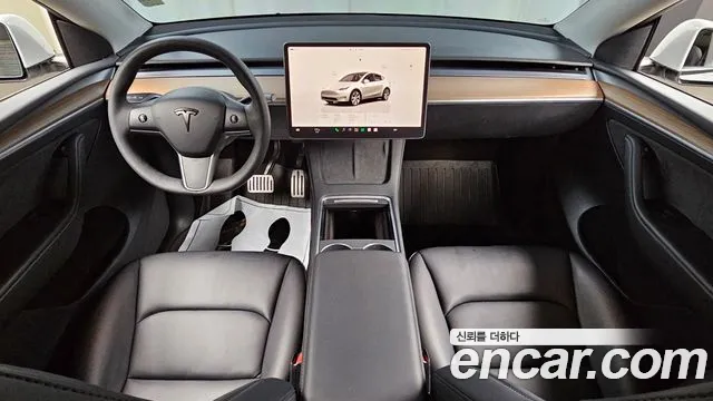 Tesla Model Y — Фото автомобиля 10