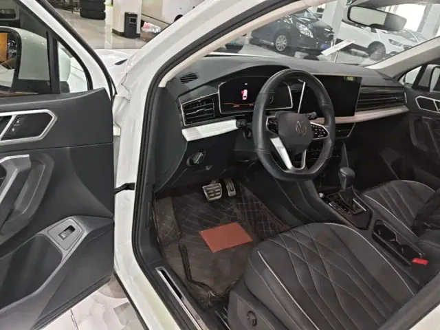 Volkswagen Tiguan L — Фото автомобиля 15