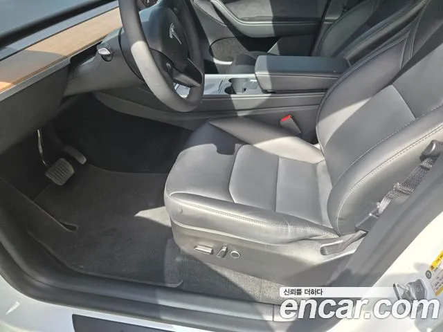 Tesla Model Y — Фото автомобиля 13