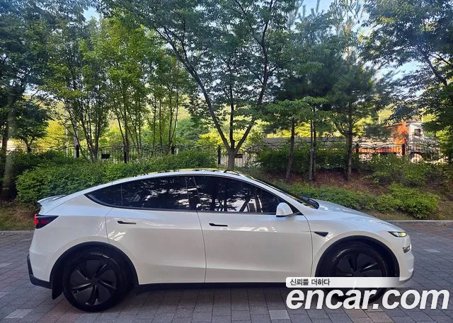 Tesla Model Y — Фото автомобиля 7