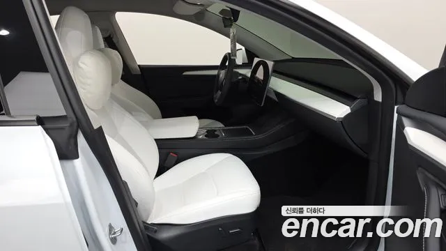 Tesla Model Y — Фото автомобиля 26