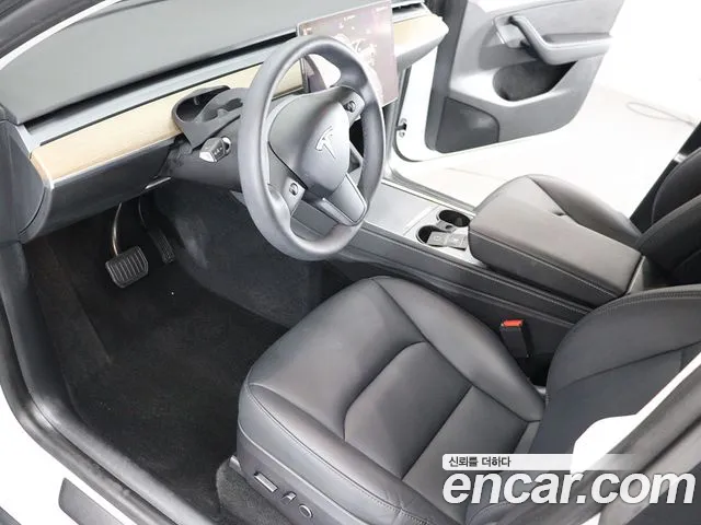Tesla Model Y — Фото автомобиля 18