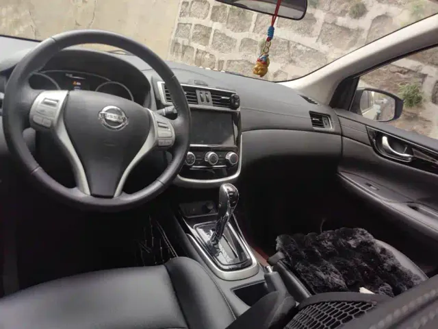Nissan Tiida — Фото автомобиля 12