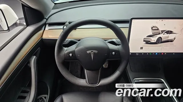 Tesla Model Y — Фото автомобиля 11