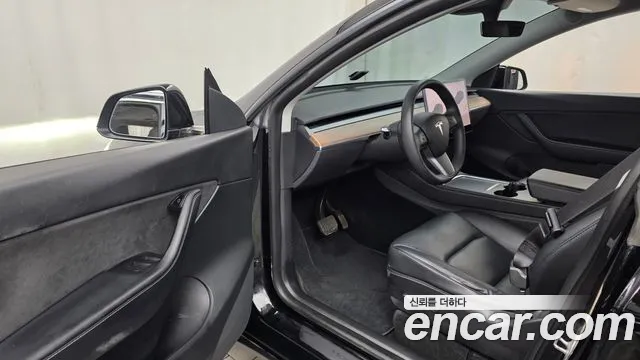 Tesla Model Y — Фото автомобиля 10