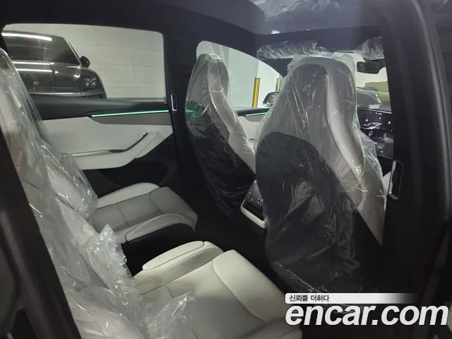 Tesla Model Y — Фото автомобиля 10