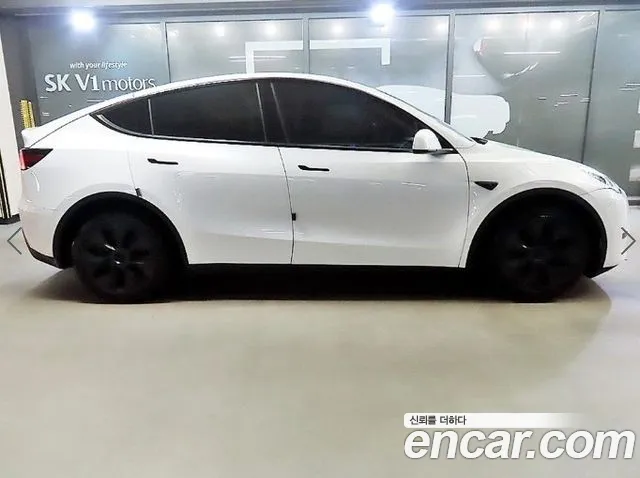 Tesla Model Y — Фото автомобиля 3