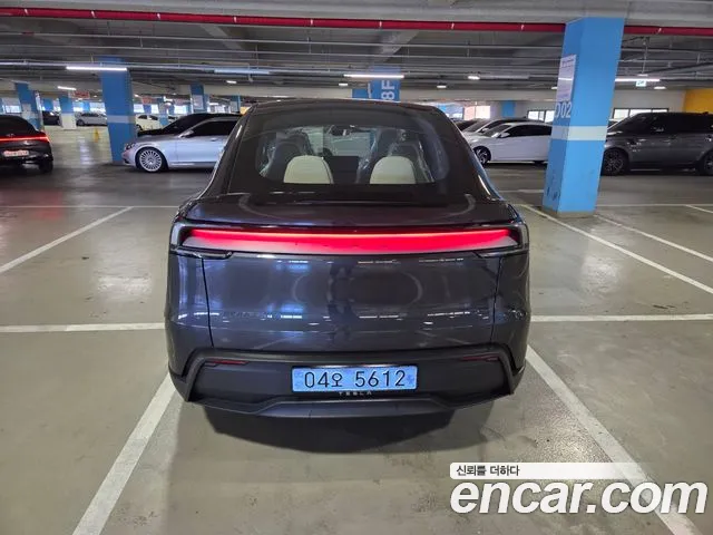 Tesla Model Y — Фото автомобиля 3