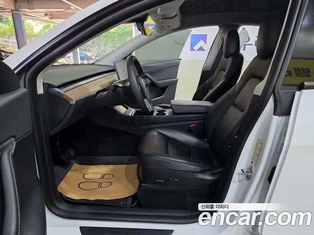 Tesla Model Y — Фото автомобиля 12