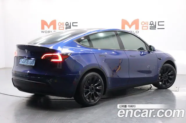 Tesla Model Y — Фото автомобиля 4