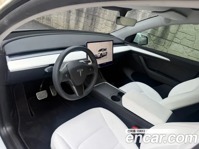 Tesla Model Y — Фото автомобиля 8