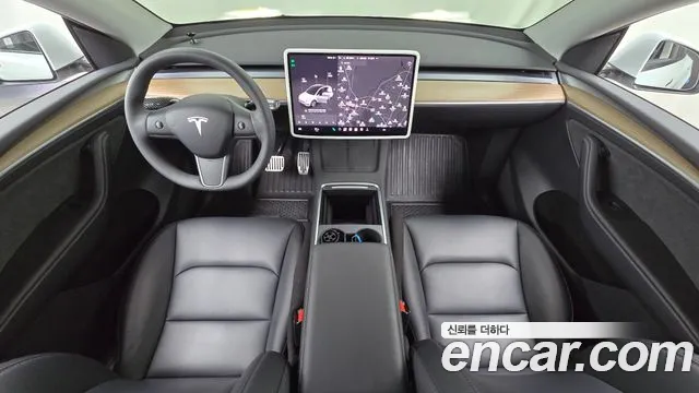 Tesla Model Y — Фото автомобиля 7
